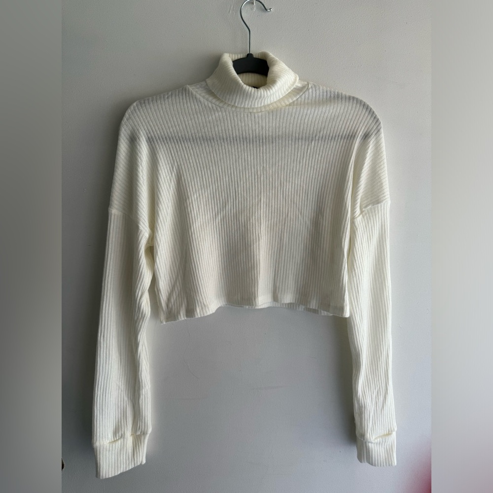 Cream long sleeve turtleneck shirt. Size Medium.